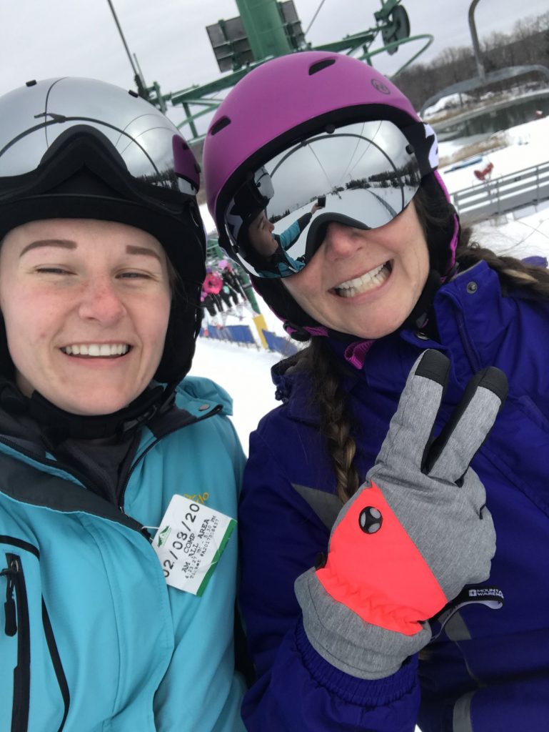 Robin & daughter skiing